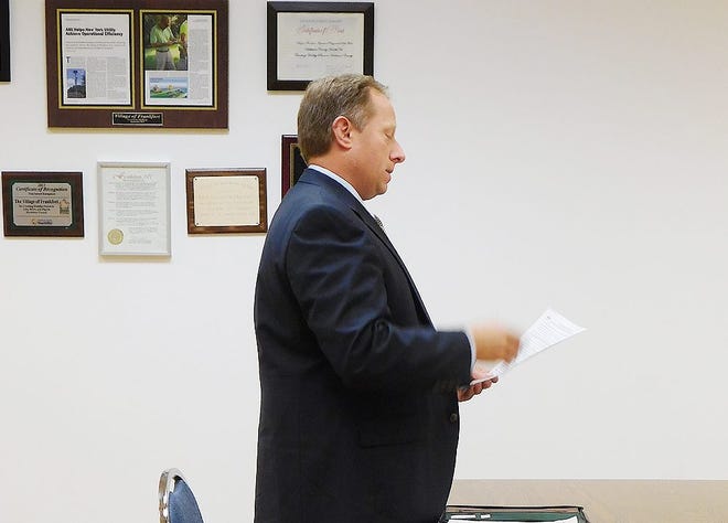 Executive Director William Rabbia of the Oneida-Herkimer Solid Waste Authority presented his analysis of the bids submitted for the village garbage contract during Wednesday's meeting of the Frankfort village board. TIMES TELEGRAM PHOTO/DONNATHOMPSON