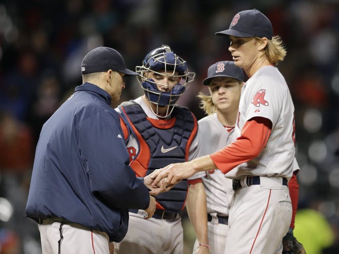 Henry Owens hands the ball to interim manager Torey Lovullo in the fifth inning.