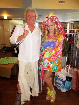 Father and daughter modeling team John and Lexi Sutyak from Beverly get ready backstage to model “Upcycled Rain Gear.” COURTESY PHOTO