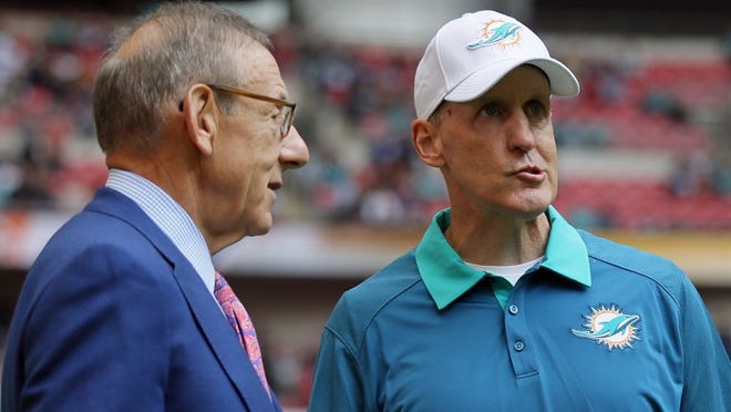 Dolphins owner Stephen Ross and coach Joe Philbin, shown before the Dolphins' loss Sunday to the Jets, talked after the game. With the Dolphins off to a disappointing start, the coach's job status is a hot debate topic. (AP photo)