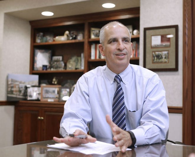Edward J. Roth III, president and CEO of Aultman Health Foundation and Aultman Hospital, sits in his office.
