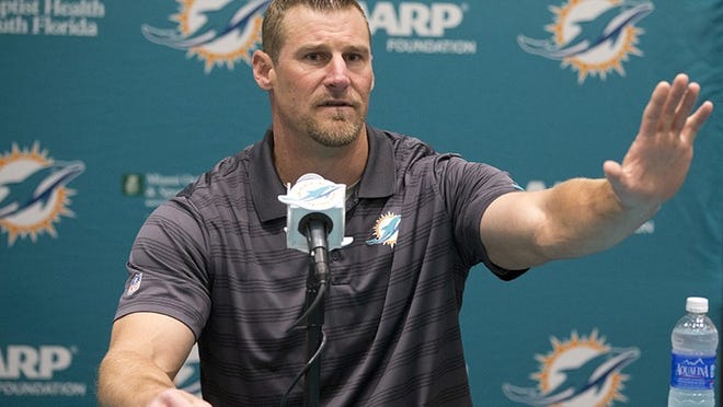 Former Miami Dolphins tight ends coach Dan Campbell speaks during a news conference after being promoted to interim head coach, Monday, Oct. 5, 2015 in Davie, Fla. Joe Philbin has been fired four games into his fourth season as coach of the Dolphins, and one day after a flop on an international stage that helped to seal his fate. (AP Photo/Wilfredo Lee)