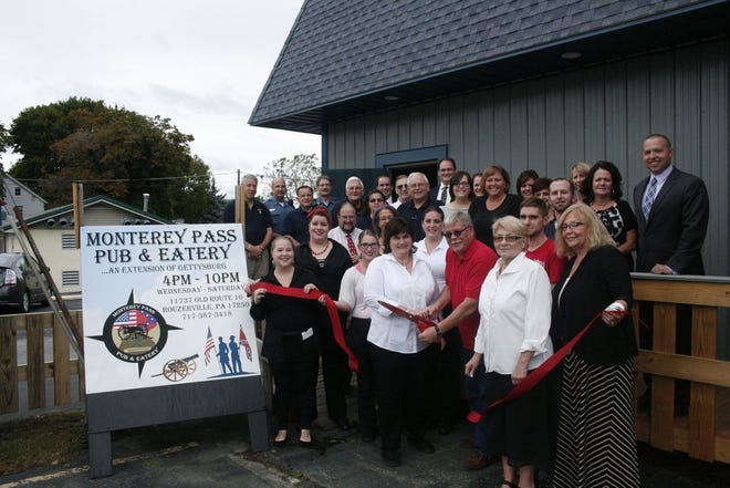 Local dignataries and community members gathered last week for the ribbon cutting for the new Monterey Pass Pub & Eatery.