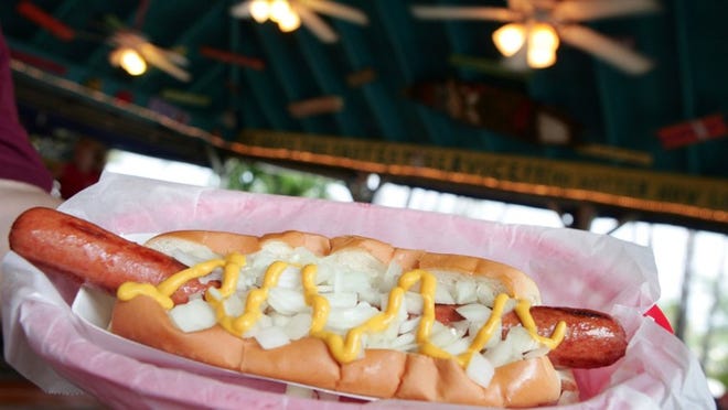 Foot-long with onions and mustard at Dune Dog. (Richard Graulich/ Palm Beach Post)