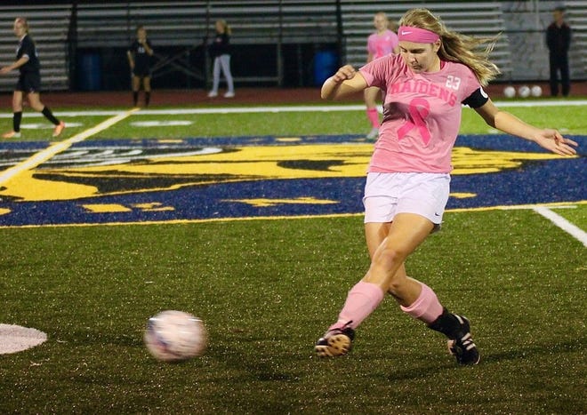 Waynesboro's Cat Weber, wearing a Breast Cancer Awareness jersey and pink socks, passes the ball during Monday's non-conference girls' soccer game against South Western.