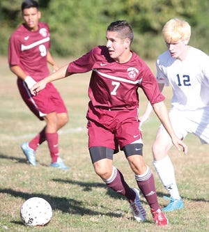 Photo by Jake West/New Jersey Herald — Newton senior Alejandro Patiño has overcome two right kneecap dislocations and a move from Colombia to the United States to lead the Braves to an unbeaten record this season.