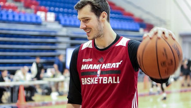 Goran Dragic talks with a teammate during the Miami Heat’s practice at Florida Atlantic University on September 29, 2015. (Richard Graulich / The Palm Beach Post)