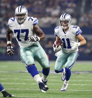 Tyron Smith (77) of Dallas blocks for wide receiver Cole Beasley during the Cowboys-Giants game on Sept. 13.