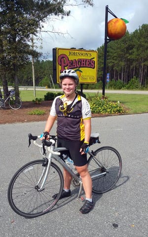 Harley Angel stops at Johnson's Peaches on day four of Cycle North Carolina's seventeenth annual Mountain To Coast tour. On day four, Angel and the other rides rode 79 miles from Concord to Southern Pines. Angel participated in the ride in honor of her father who recently passed away.