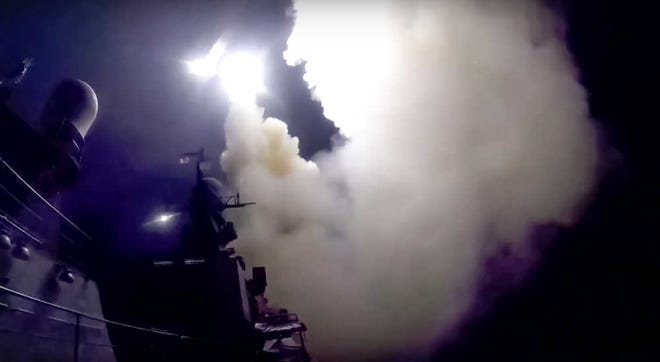 In this photo made from the footage taken from Russian Defense Ministry official web site, Wednesday, Oct. 7, 2015, a Russian navy ship launches a cruise missile in the Caspian Sea. Russia's Defense Minister Sergei Shoigu said four Russian navy ships in the Caspian launched 26 cruise missiles at Islamic State targets in Syria.(Russian Defense Ministry Press Service via AP)