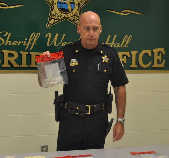 Major Bob Johnson of the Santa Rosa County Sheriff’s Office holds an evidence bag containing more than 50 grams of heroin during a Thursday morning press conference. Johnson said a search warrant led to the arrest of Monica Nicole-Gonzalez Jones at Arlingwood Drive in Milton on Thursday morning. Johnson estimated the total amount of drugs seized by the search warrant to be around $20,000 in street value.