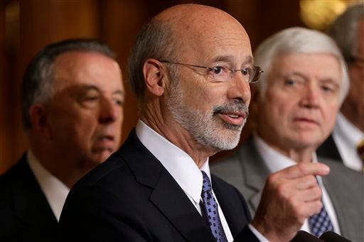 Pennsylvania Gov. Tom Wolf, center, accompanied by House Minority Leader Rep. Frank Dermody, D-Allegheny, right, and Rep. Joe Markosek D-Allegheny, the ranking Democrat on the Appropriations Committee, speaks Wednesday, Oct. 7, 2015, at the state Capitol in Harrisburg, Pa. Gov. Tom Wolf's hopes of ending Pennsylvania's 99-day-old state budget impasse were dashed Wednesday when nine of his fellow Democrats joined all House Republicans to vote against his revised plan to raise billions in income and gas drilling taxes. (AP Photo/Matt Rourke)