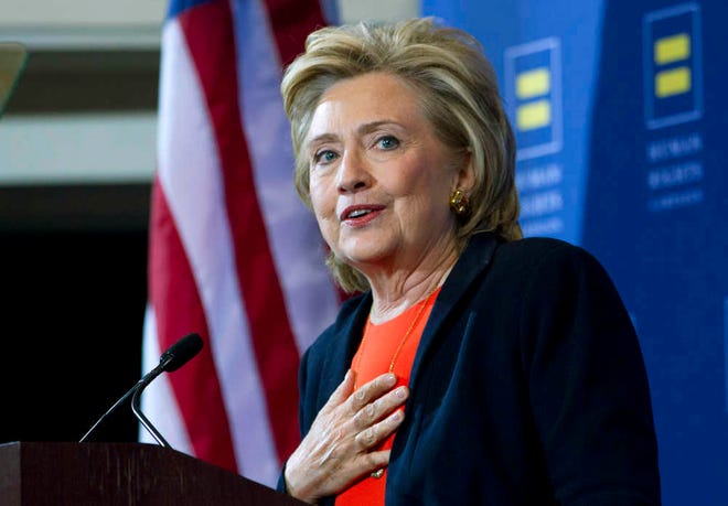 FILE - In this Oct. 3, 2015 file photo, Democratic presidential candidate Hillary Rodham Clinton gestures as she speaks at Human Rights Campaign gathering in Washington. Just days after a deadly shooting in Oregon, Clinton will unveil new gun control measures on Monday, Oct. 5, aimed at strengthening background checks on gun buyers and eliminating legal immunity for sellers. (AP Photo/Jose Luis Magana, File)