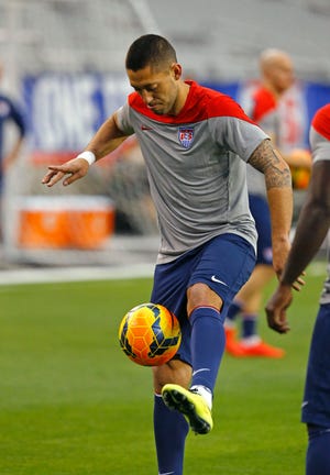 In this April 1, 2014 file photo, U.S. Men's National Team captain Clint Dempsey runs drills during practice in Glendale, Ariz. Dempsey has known all about the importance of the U.S. soccer rivalry with Mexico since he was a Texas kid. The Americans face El Tri on Saturday, Oct. 10, 2015, for a spot in the Confederations Cup.