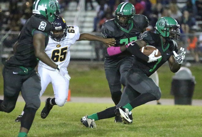 North Lenoir running back Stephon Swinson finds an opening in the Goldsboro defense during Friday's game in La Grange.