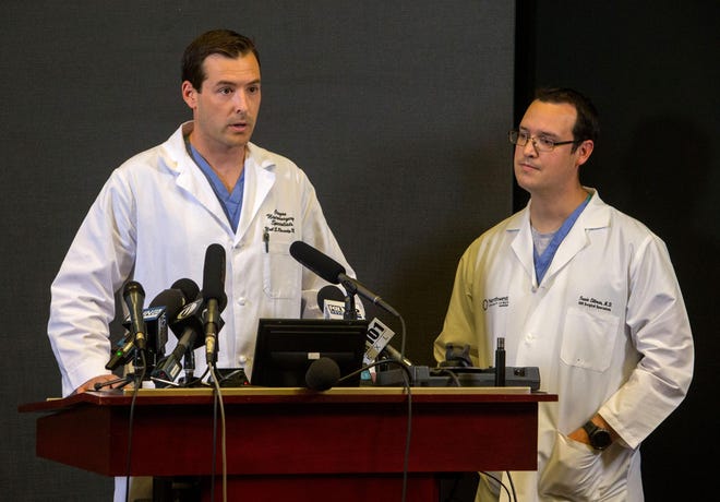 Neurosurgeon Dr. Neil Roundy, (left) and Dr. Travis Littman, Medical Director of Trauma, give updates on the condition of Umpqua Community College shooting victim Julie Woodworth at the RiverBend Annex in Springfield, Ore. Thursday, October 8, 2015. Woodworth remains in critical condition at PeaceHealth Medical Center at RiverBend in Springfield since last Thursday. (Brian Davies/The Register-Guard)