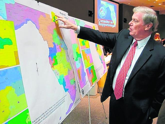 State Sen. John Thrasher, R-St. Augustine, examines a Florida Senate 
redistricting map in March 2012 during a meeting of the Senate Redistricting 
Committee in Tallahassee. A lawsuit filed by the League of Women Voters and other groups contends that the Legislature's process for redrawing Florida's congressional districts violated provisions of the state constitution.