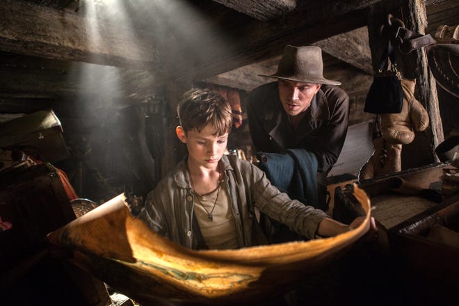 Peter (Levi Miller) and James Hook (Garrett Hedlund) chart a course in their flying ship.