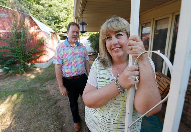 Breast cancer survivor Tina Thompson and her husband, Terrell, stand in their Lubbock backyard Oct. 1. Tina underwent surgery Sept. 15 to remove the cancer and began the process of reconstruction. She emerged from surgery cancer-free and didn't have to do chemotherapy.