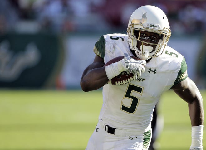 South Florida running back Marlon Mack (5) scores on a 25-yard touchdown run against Syracuse during the third quarter of an NCAA college football game Saturday, Oct. 10, 2015, in Tampa, Fla.