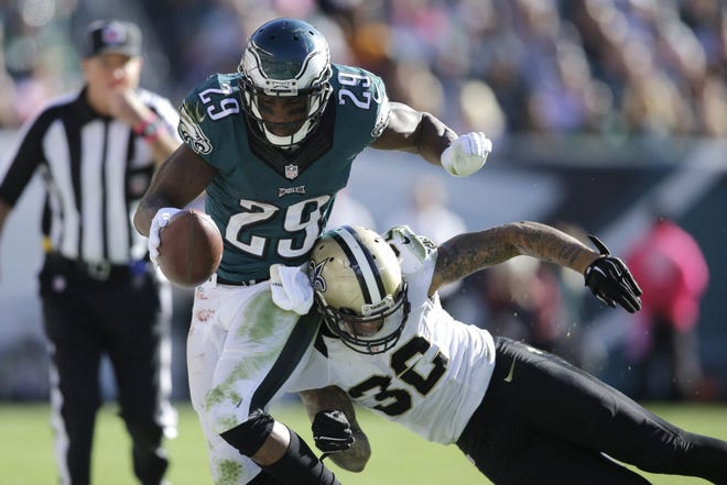 Eagles running back DeMarco Murray (29) tries to elude Saints safety Kenny Vaccaro during the second half of Sunday's game at the Linc.