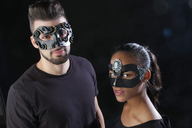 Joseph M. Travers III and Nejia L. Calhoun model masks by Jazmyn Johnson. A student at the Community College of Rhode Island, Johnson designs her masks around a variety of themes, from mermaids to the Victorian era to Julius Caesar. 

The Providence Journal/Sandor Bodo