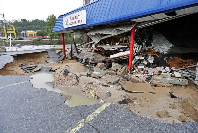 Associated Press file photoA business is destroyed on Monday by flooding near Gills Creek in Columbia, S.C. Over the past week, as the water rose after days of unrelenting rain in the heart of South Carolina, the creek spilled misery and pain on rich and poor alike, robbing both of the things most precious to them.
