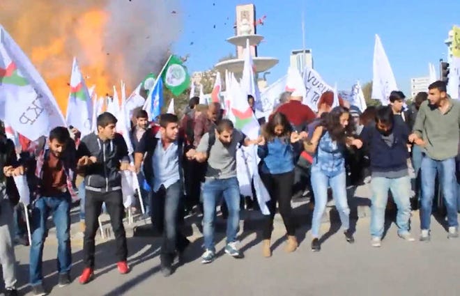 Dokuz8Haber via AP VideoIn this image made from video, participants in a peace rally react as an explosion happens behind them on Saturday in Ankara.