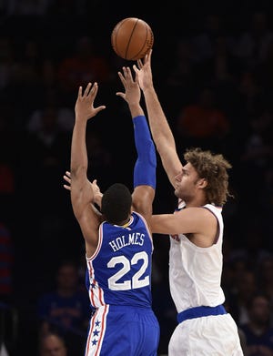 Knicks center Robin Lopez shoots over the Sixers' Richaun Holmes (22) during the first half of Monday night's preseason game.
