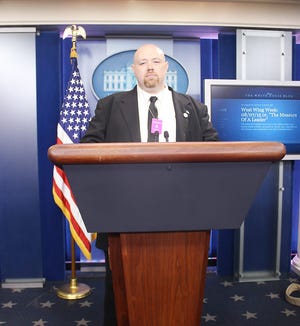 Jeff Szczesniak, a 1995 graduate of St. Johnsville Central School, station advisor Cayuga Community College’s radio station, WDWN, is pictured in the press briefing room at the White House. WDWN was one of five college radio stations nationally that was invited to represent the medium of college radio at the White House on Sept. 24. SUBMITTED PHOTO