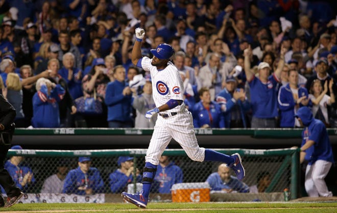 Chicago Cubs center fielder Dexter Fowler (24) runs bases after hitting a home run against the St. Louis Cardinals during the eighth inning of Game 3 in baseball's National League Division Series, Monday, Oct. 12, 2015, in Chicago. (AP Photo/Nam Y. Huh)