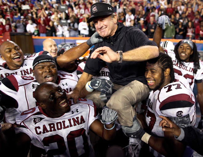 South Carolina coach Steve Spurrier is lifted up by his players during the final moments of the second half of Florida's 36-14 loss against South Carolina at Ben Hill Griffin Stadium in Gainesville, Florida November 13, 2010. Photo by Rob C. Witzel / Staff
