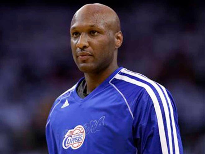 FILE - This Jan. 2, 2013 file photo shows Los Angeles Clippers' Lamar Odom (7) in action against the Golden State Warriors during an NBA basketball game in Oakland, Calif. Authorities say former NBA and reality TV star Odom has been hospitalized after he was found unconscious at a Nevada brothel. Nye County Sheriff Sharon A. Wehrly says the department got a call Tuesday afternoon, Oct. 13, 2015, requesting an ambulance for an unresponsive man at the Love Ranch in Crystal, Nevada about 70 miles outside of Las Vegas.