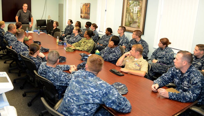 Scott Benning, a member of the Department of the Navy's Sexual Assault Prevention and Response Office, talks with NAS Jacksonville Sailors on how to prevent and respond to sexual assault - eliminating it from Navy ranks through a balance of focused education, comprehensive response and compassionate advocacy.