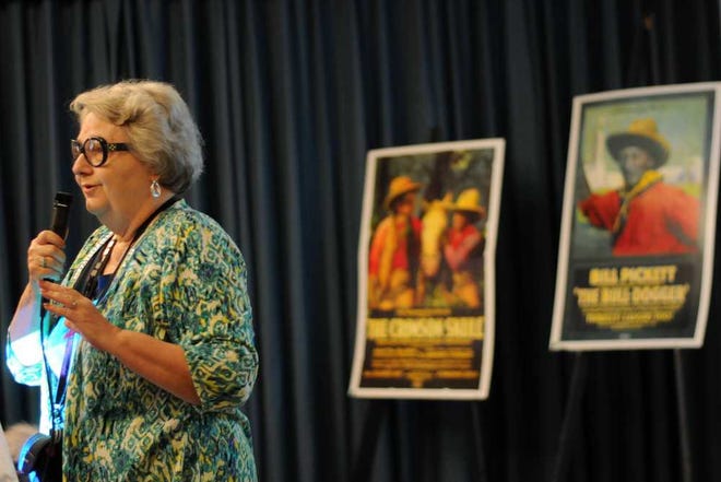 Christina.Kelso@jacksonville.com --7/13/14- Rita Reagan, co-chair and community and education director of Norman Studios, introduces "A Florida Enchantment," a 1914 silent movie filmed in Jacksonville and St. Augustine, at the organization's first Silent Sunday film screening at the Hotel Indigo Sunday July 13. Norman Studios will host the Silent Sundays film series the second Sunday of each month at the hotel. (Christina Kelso/The Florida Times-Union)