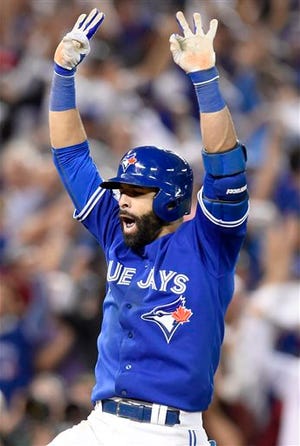 Toronto Blue Jays' Jose Bautista celebrates after hitting a three-run home run against the Texas Rangers during the seventh inning in Game 5 of baseball's American League Division Series, Wednesday, Oct. 14, 2015 in Toronto. (Frank Gunn/The Canadian Press via AP) MANDATORY CREDIT