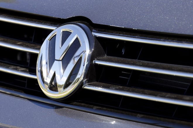 In a September photo, the grille of a Volkswagen for sale is decorated with the iconic company symbol. AP Photo, file / Brennan Linsley