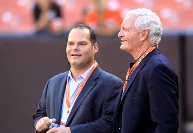 Cleveland Browns owner Jimmy Haslam talks with then general manager Tom Heckert before ta 2012 preseason game. Heckert, later fired by Haslam, is is in his third year as Denver’s director of pro personnel.