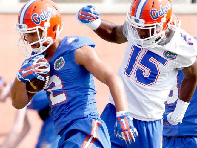 In this Mar. 18, 2015 file photo, Florida Gators wide receiver Ryan Sousa runs up field past defensive back Deiondre Porter (15) during spring football practice on Wednesday, March 18, 2015 in Gainesville.