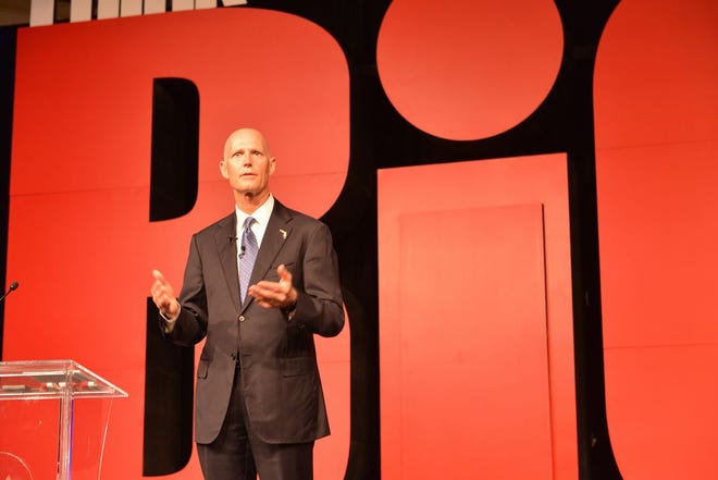 Gov. Rick Scott addresses the audience at the Gulf Power Symposium at Sandestin on Tuesday.
