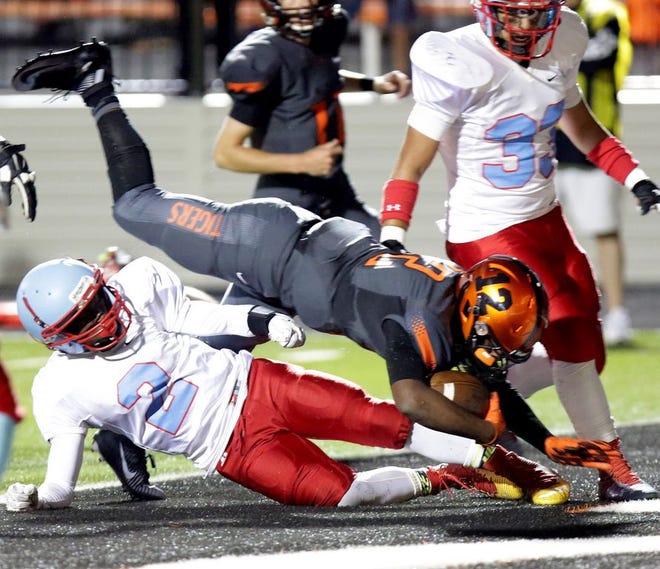 Massillon’s Keyshawn Watson scores a touchdown during a game last month against Toledo Bowsher.