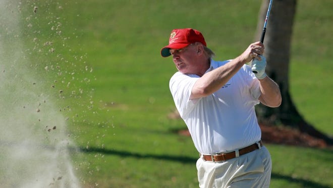 Donald Trump plays a round of golf at Trump International Golf Club in West Palm Beach in 2011. In a federal lawsuit, members of a Jupiter golf course now owned by a Trump entity claim their memberships were wrongly canceled and their deposits were not returned within 30 days, as required. (Allen Eyestone/The Palm Beach Post)