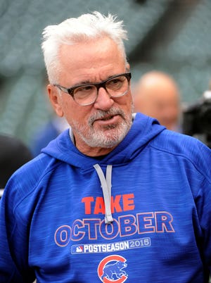 Chicago Cubs manager Joe Maddon watches his team workout in preparation for Game 1 of baseball's National League Championship Series in Chicago, Thursday, Oct. 15, 2015.