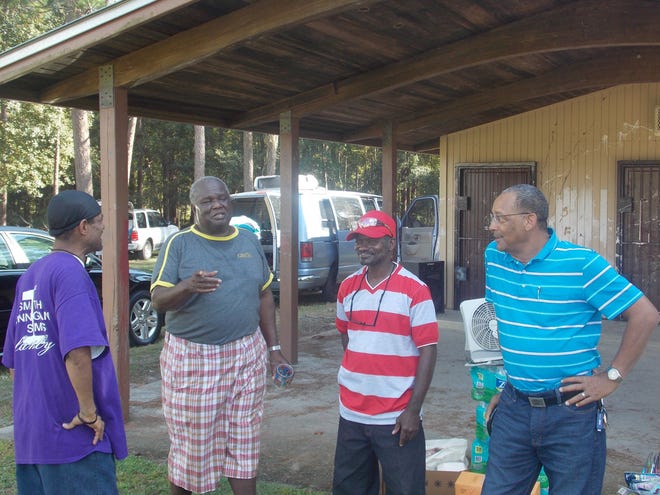The Lake Road neighborhood held its annual reunion at Fred Cone Park with former and current members of the east Gainesville affordable housing community gathering in fellowship with one another. From left are Alfred “Butter” Knight, Charles Lindsey, Larry Roberts and Jerome Jones.