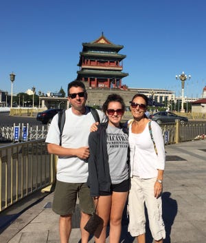 Katherine and her parents visit Tiananmen Square in Beijing while on a trip to finalize the adoption of her brother.