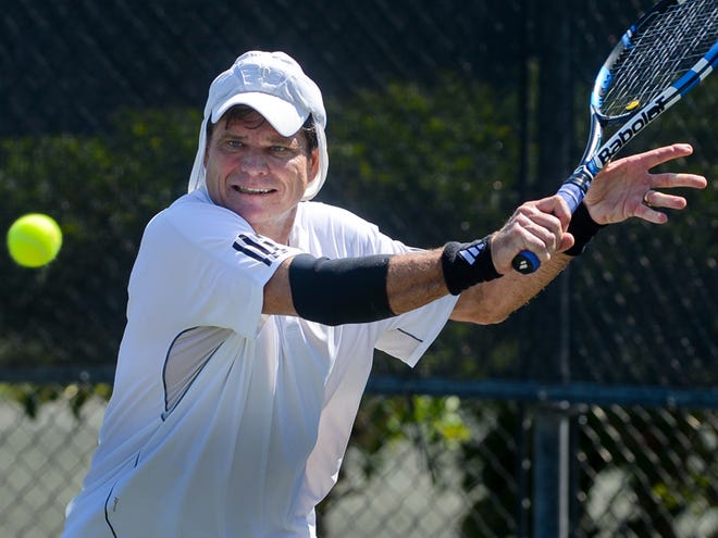 Rill Baxter, shown here playing in a match against Doug Elly during the National 50s Clay Court Tournament at the Bath and Racquet Fitness Club in Sarasota on Thursday, lost to second-seeded Jeffrey Burnett on Friday.
