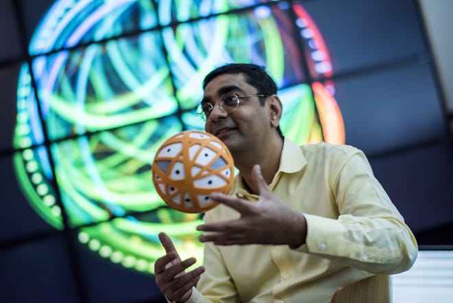 Dharmendra Modha, chief scientist for Brain Inspired Computing at International Business Machines Corp., works in the SyNAPSE chip testing room at the IBM Almaden Research Center in San Jose, California. Photo/Bloomberg News