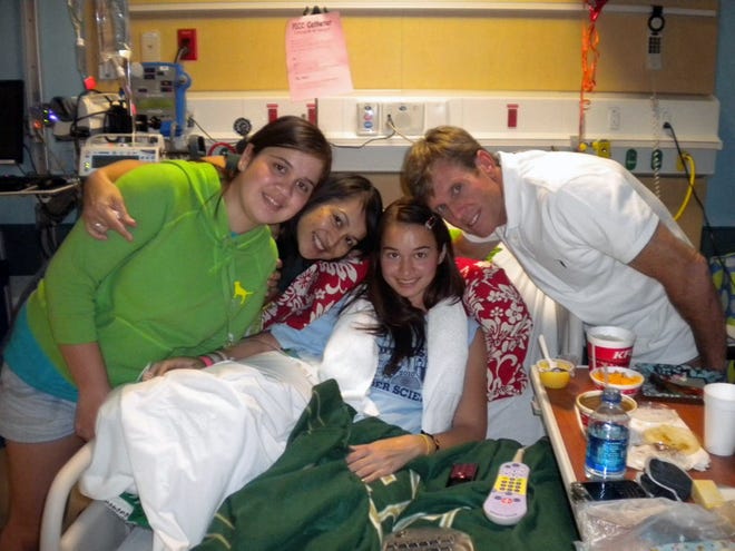 The O'Hara family, from left, Lindsey, Jean, Lauren and Patrick, pose for a photo in Lauren's hospital room at All Children's Hospital in St. Petersburg, in 2010. COURTESY PHOTO