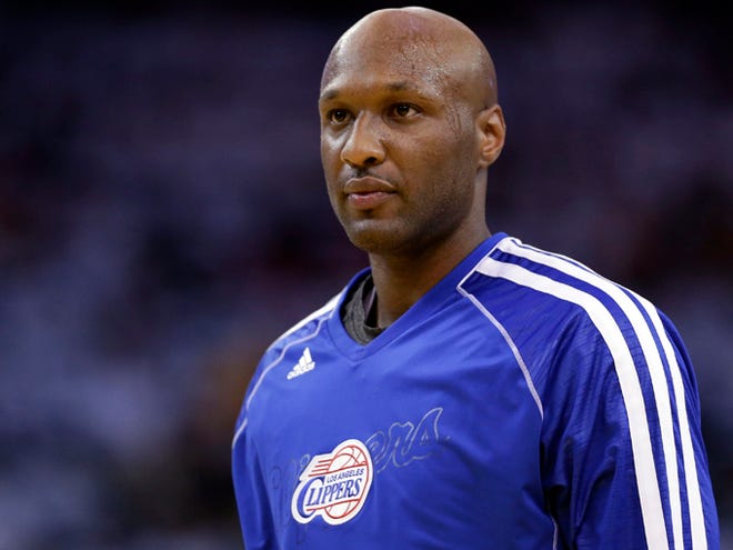 This Jan. 2, 2013 file photo shows Los Angeles Clippers' Lamar Odom (7) in action against the Golden State Warriors during an NBA basketball game in Oakland, Calif. Authorities say former NBA and reality TV star Odom has been hospitalized after he was found unconscious at a Nevada brothel. Nye County Sheriff Sharon A. Wehrly says the department got a call Tuesday afternoon, Oct. 13, 2015, requesting an ambulance for an unresponsive man at the Love Ranch in Crystal, Nevada about 70 miles outside of Las Vegas. (AP Photo/Marcio Jose Sanchez, File)