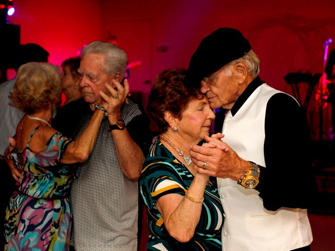 James and Linda Shearer dance to "Wonderful Tonight" during the weekly gathering of the Keystone Social Club on Thursday, Oct. 8, 2015 in Keystone Heights, Fla. The group gets together each week for a pot-luck dinner, dancing and socializing.